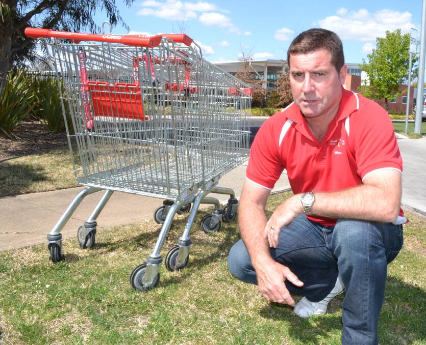 TRY AGAIN: Councillor Warren Aubin says council has decided to impound discarded shopping trolleys and charge $46 for their release.  053116trolley1