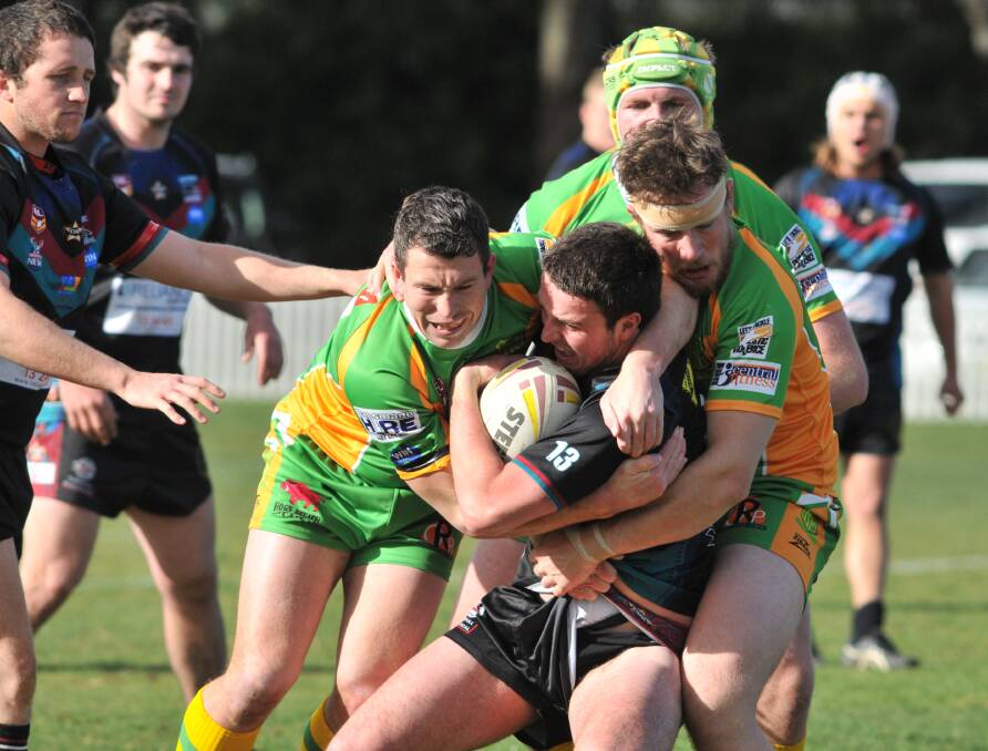 HOLD TIGHT: Panthers Jake Betts tries to wrestle his way out of trouble as his side succumbed to a much stronger Orange CYMS side yesterday. Photos: JUDE KEOGH 0719cyms1