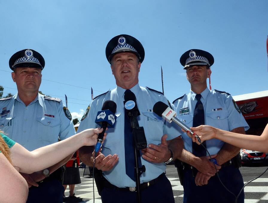 THE BLUE LINE: Senior Sergeant Peter McMenamin, Assistant Commissioner Geoff McKechnie and Chifley Local Area Commander Superintendent Michael Robinson at the launch of Operation Lenton at Mount Panorama yesterday. Photo: PHILL MURRAY 100914prace4