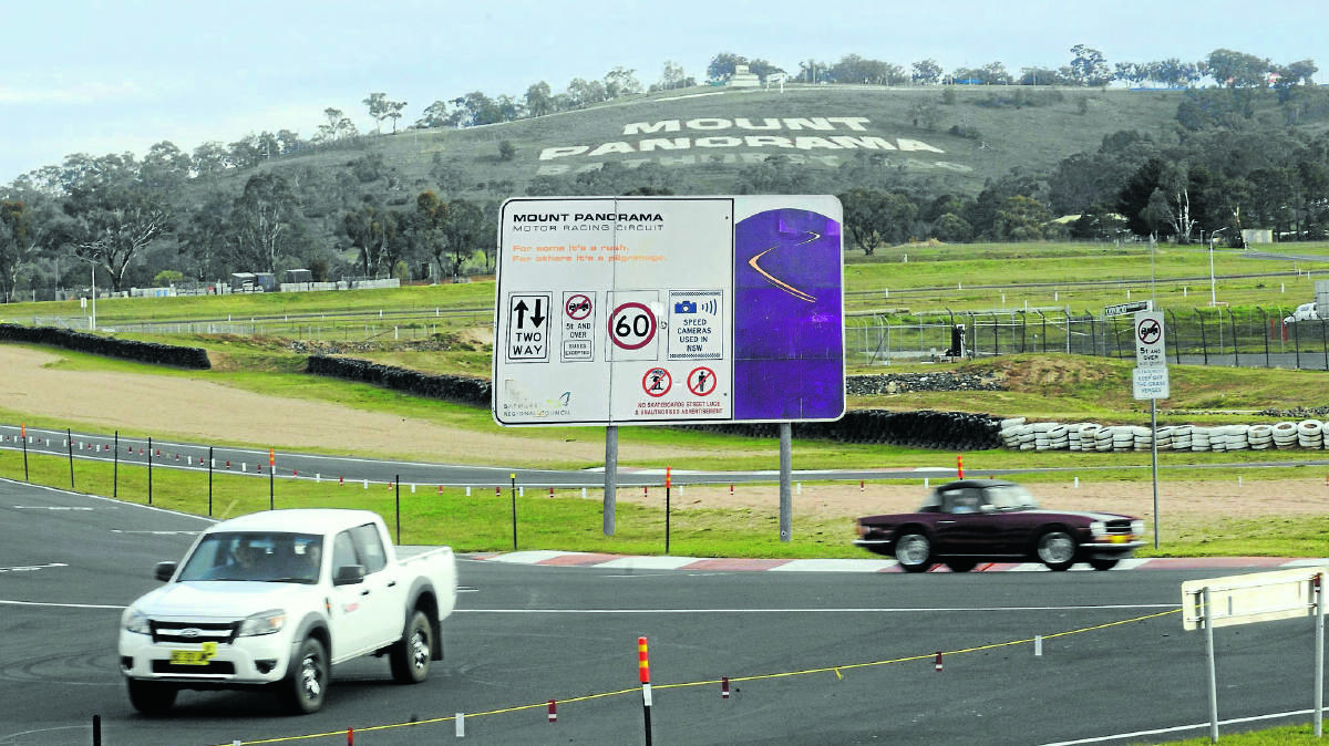 WELL PLACED: An artist’s impression of where a warning sign should be placed at the main entrance to Mount Panorama. The call for additional warnings has come from a Bathurst paramedic following two serious accidents so far this year. Photo: CHRIS SEABROOK
