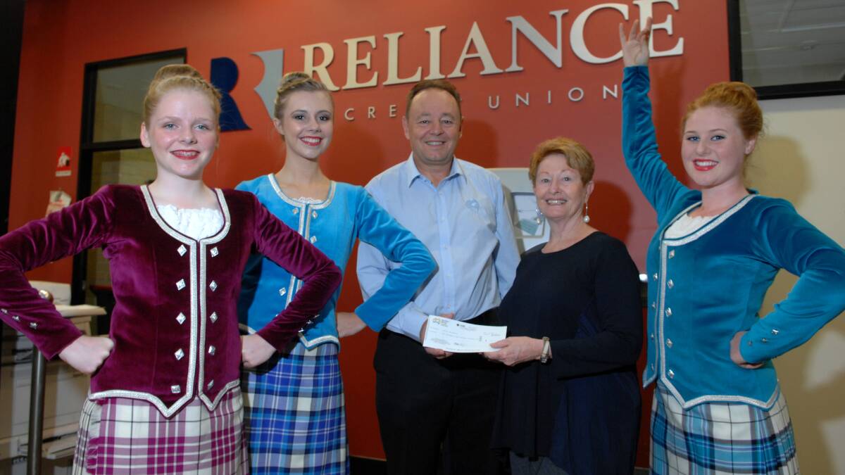 HIGHLAND FLING: OzScot dancers Sophie Hogan, Kaitlin Collins and Neve Moore with Reliance Credit Union’s Mark Genovese and their dance director Cheryl Roach. The girls were the beneficiary of a funding boost to go towards costumes for their upcoming overseas performance. Photo: ZENIO LAPKA 031314zbasel