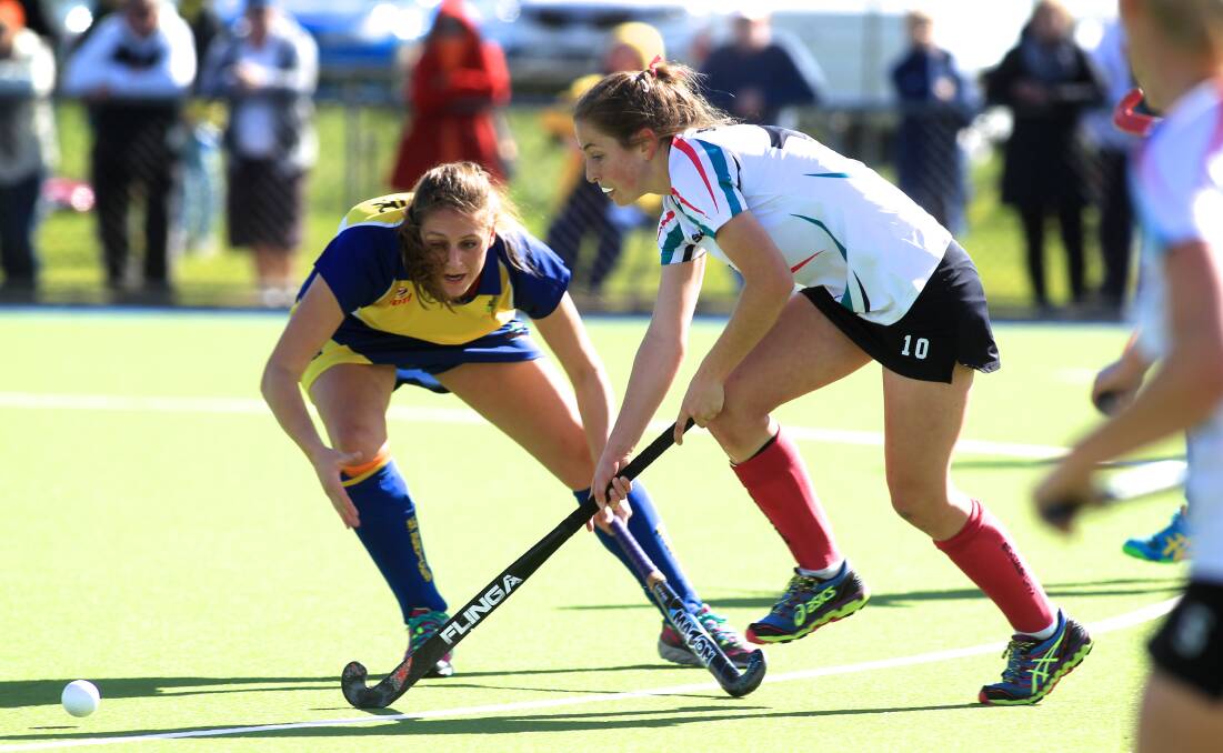 SCRAPING THROUGH: Kelly Baker and her Bathurst City team-mates are into yet another grand final after defeating Ex-Services in a penalty shoot-out on the weekend. Photo: PHIL BLATCH 	082915pbhockey7