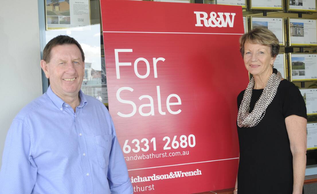 NEW NAME: Peter Ison and Cherrie Tobin are changing their brand allegiance to Richardson and Wrench on Monday. Photo: CHRIS SEABROOK 112614cR&W
