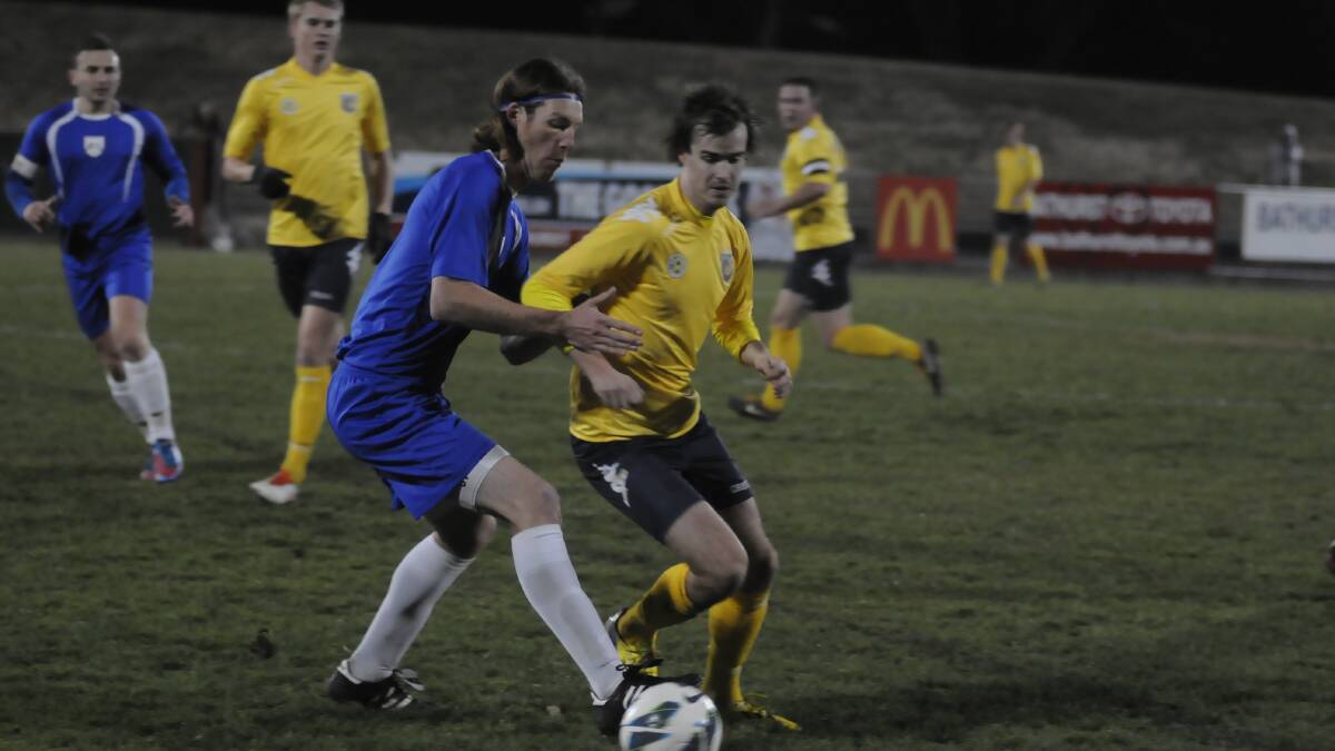 FRESH START: James Christie (right) will be hoping his Western Mariners side can make it a winning start to their State League 1 season against Gladesville. Photo: CHRIS SEABROOK 072713cmsoc3b
