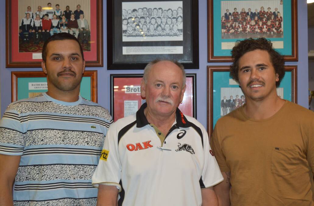 NEW FACES: Jeremy Gordon (left) and Sandon Gibbs-O’Neil (right) were signed up by Bathurst Panthers this week. The club executive, including secretary Wayne Boyd (centre), are delighted to have the talented backs on board. Photo: DEBARAH MINA DSC_0434