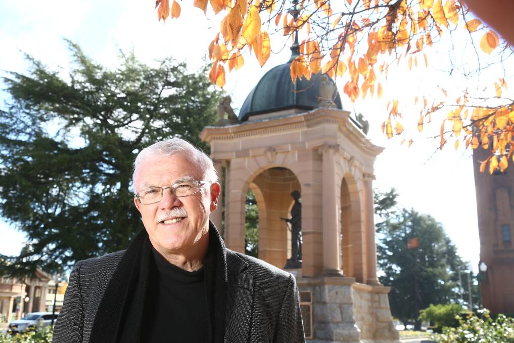 GREAT HONOUR: Bathurst Macquarie Heritage Medal nominee Graham Lupp with one of his favourite Bathurst landmarks, the Boer War Memorial in Kings Parade. Photo: PHIL BLATCH	 050415pblupp7