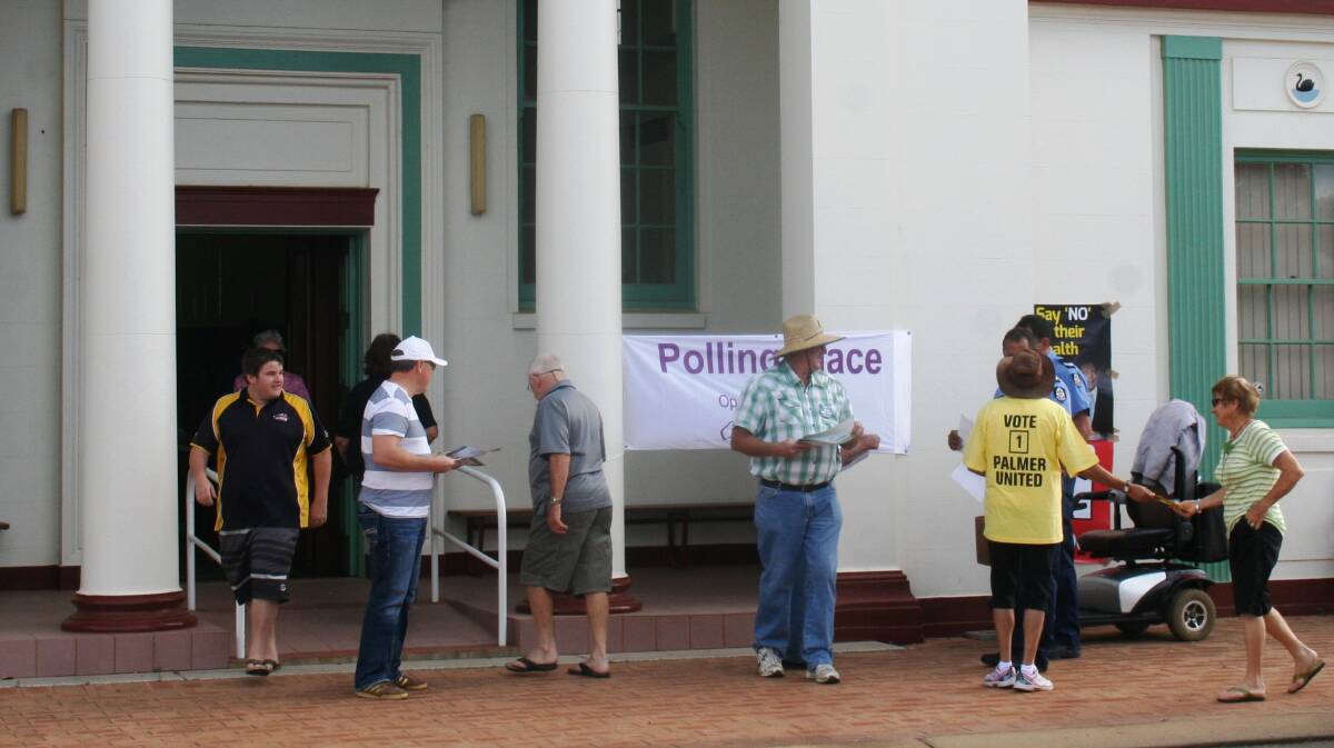 Liberal, Nationals, Labor and Palmer United Party supporters handing out ho-to-vote cards outside Merredin court house. They were later joined by Greens supporters.