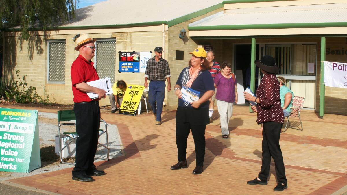 Durack MP Melissa Price handing out how-to-vote cards outside Merredin Senior Citizens Centre.