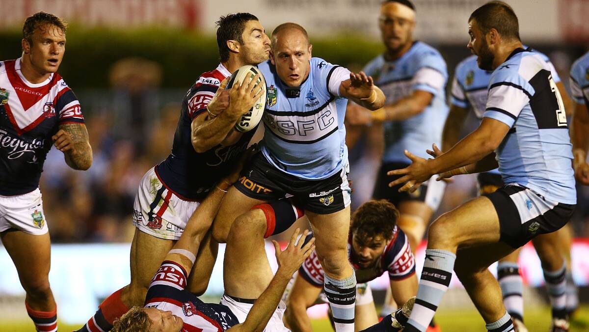 Jeff Robson of the Sharks on the attack during the round seven NRL match between the Cronulla-Sutherland Sharks and the Sydney Roosters at Remondis Stadium on April 19, 2014 in Sydney, Australia. Photo: Mark Nolan/Getty Images.