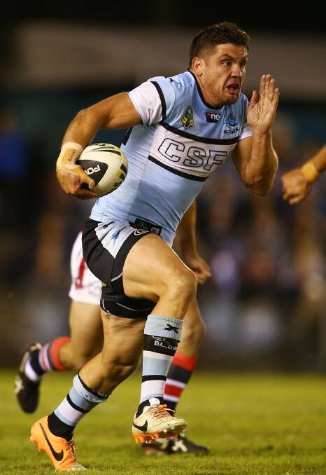  Chris Heighington of the Sharks makes a line break during the round seven NRL match between the Cronulla-Sutherland Sharks and the Sydney Roosters at Remondis Stadium on April 19, 2014 in Sydney, Australia. Photo: Mark Nolan/Getty Images.