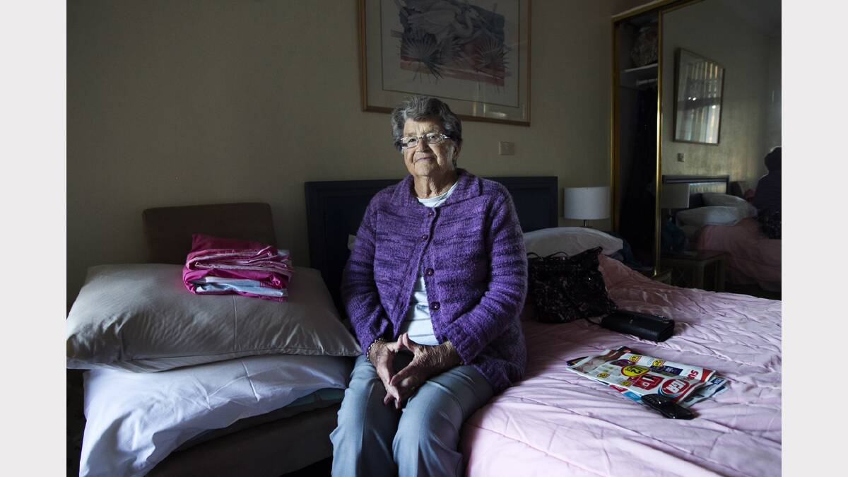 Jean Roberston, 83, goes to play bingo every Tuesday, where she can talk with some of the other flood displaced people about her situation. She has been living at the Tall Timbers motel since her unit was destroyed. Photo: Ella Rubeli
