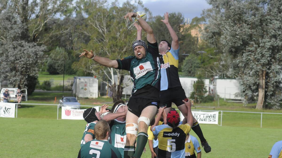 HIGH BATTLE: Orange Emus and CSU Bathurst lineout jumpers vie for possession at University Oval on Saturday. Photo: CHRIS SEABROOK