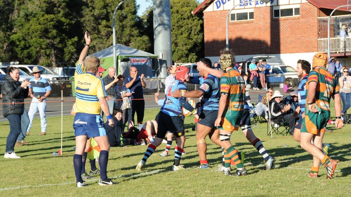 PARTY TIME: Dubbo players run to celebrate with Blake Sharpe after he scored what turned out to be the match winner on Saturday. Photo: BELINDA SOOLE