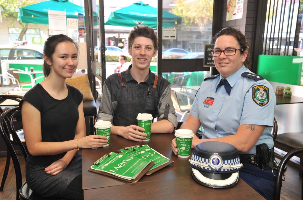 COFFEE WITH A COP: Jodie Clothier and Justin Sandry sit down with Inspector Linda Bradbury who wants others to have a coffee and a chat about crime in Orange with Canobolas LAC Superintendent Shane Cribb next week. Photo: JUDE KEOGH. 0427coffee1