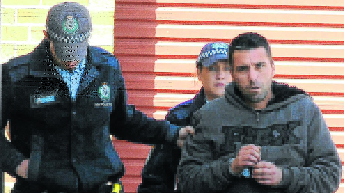 BOMBSHELL: Liverpool man Ryan Paget is led into Orange Local Court to face charges after police searched his vehicle finding an explosive device and drugs. Photo: STEVE GOSCH