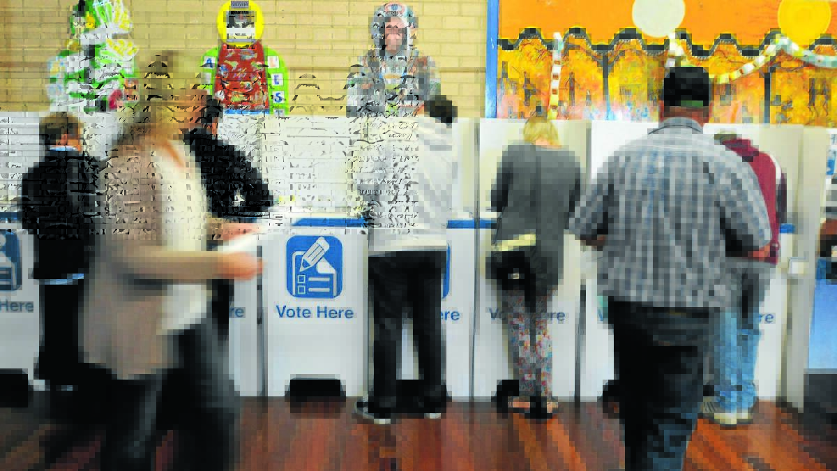 PEN TO PAPER: Orange residents vote in the state election on Saturday. Photo: JUDE KEOGH  