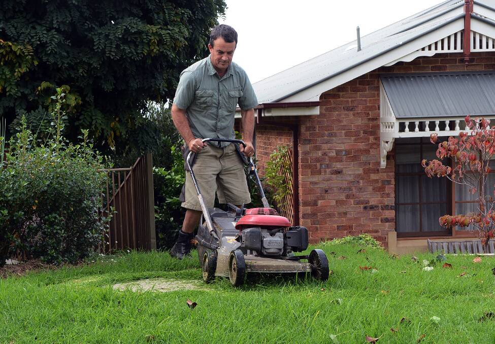GREEN GRASS OF HOME: It has been a busy autumn mowing grass for Paul Fogarty and a great boost to his business. Photo: PHILL MURRAY  041614ppaul