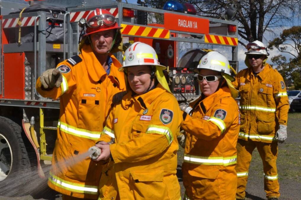 READY FOR ACTION: Raglan Rural Fire Brigade senior deputy captain Fred Madden, deputy captain Skye Sutton with firefighters Sam Nash and Jake Miles are prepared and ready for what is predicted to be a busy bushfire season ahead. Photo: NADINE MORTON 092115nmbushfire1