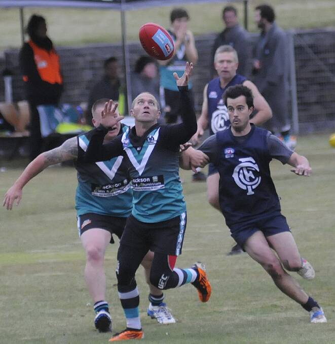 EYES ON IT: Damian Cuff chases a possession during the Bushrangers’ win over Cowra on Saturday. Photo: CHRIS SEABROOK 050314calf6