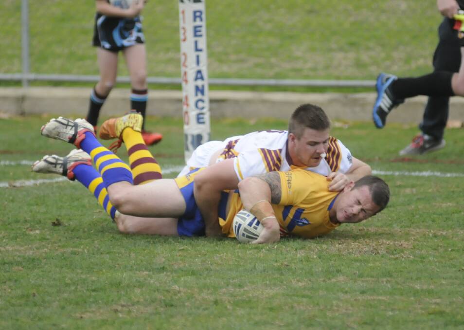 DOUBLE TIME: Danny Lawrence crosses for one of his two tries during City’s win over Country in the NSW Police Rugby League match yesterday. Photo: CHRIS SEABROOK 052015copleague
