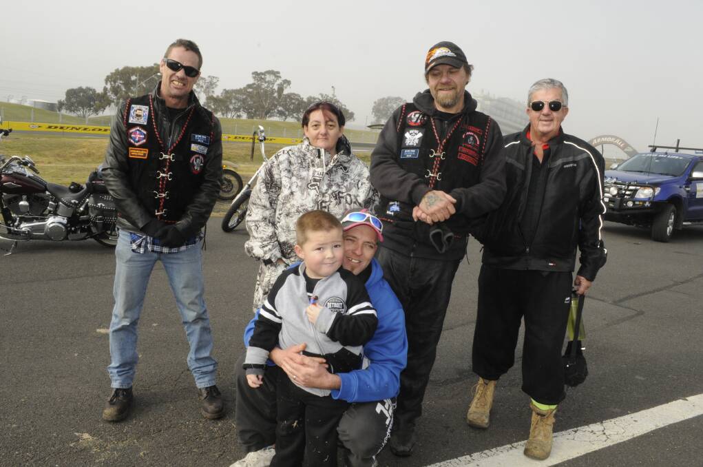 FOR SAXON: Saxon Evans with his dad Justin Evans (front) and Scott Burns, Saxon’s mum Sharon Evans, Sean Griffiths and Robert Reynolds. Mr Griffiths organised a charity bike ride for the little boy. Photo: CHRIS SEABROOK 060715csaxon