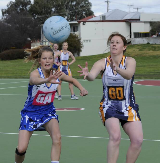 CHASING A FIRST WIN: Lily McIntosh (left) and her Collegians Shockwave team-mates will be after their maiden win for 2015 when they face Nova Fusion this afternoon. Photo: PHILL MURRAY 082413pnet8