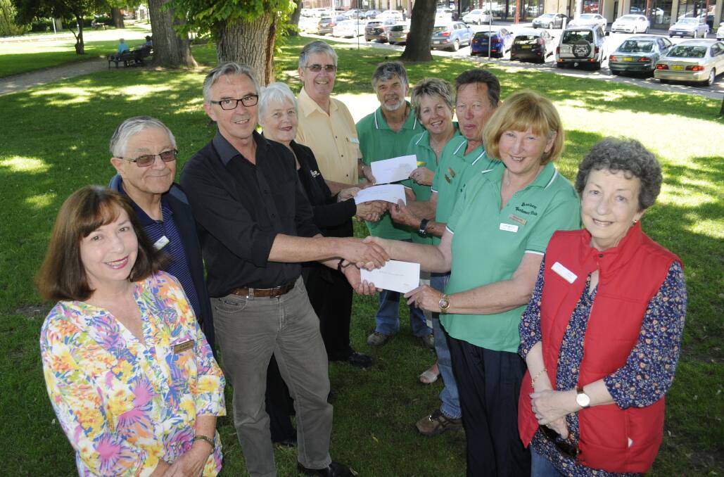 SPRING SPECTACULAR: Handing over funds raised as a result of the Bathurst Spring Spectacular are, from left, club secretary Terry Fatseas, committee member Dr John Trollor, Mitchell Conservatorium's Phil Braithwaite, Noela Sikora from 2BS, Daffodil Cottage Extension Fund’s Doug Kinlyside, Chris Bayliss, co-ordinator Anne Llewellyn, club president Peter Varman, club treasurer Judy Bayliss and Jane Rawlings. Photo: CHRIS SEABROOK 110915cspring