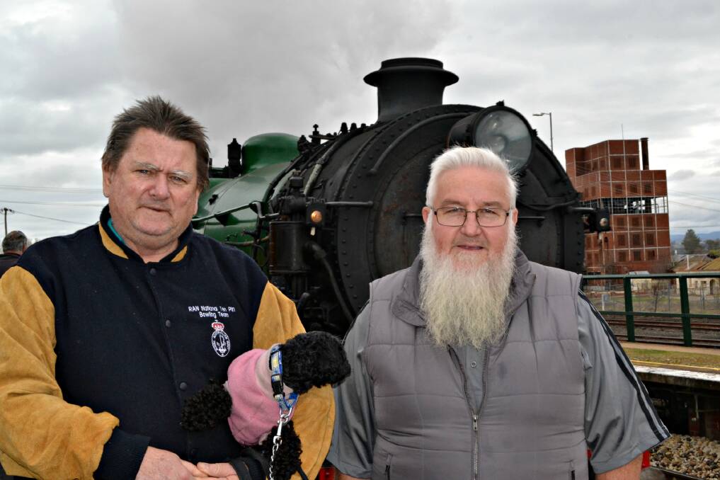 STEAM DREAM: Greg Standen, pictured with his dog Willow, and his mate Bryan Williamson were full of praise for the opportunity to ride on the heritage train Locomotive 3642. Photo: RACHEL FERRETT 082315rftrain1