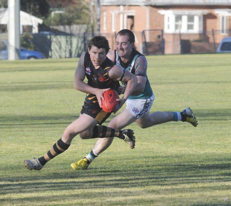 OUT: Shaun Noyen (chasing) will be one of only a few Bushrangers players missing from their side to head to Bateman’s Bay for today’s pre-season competition. Photo: CHRIS SEABROOK 082413caflgf20
