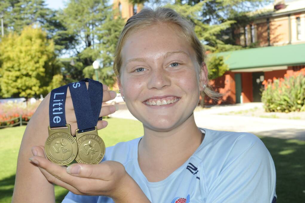 GOLDEN MOMENT: Caitlin Reeves took two gold medals home from the NSW Championships last weekend. Photo: CHRIS SEABROOK 032515caitlinr1