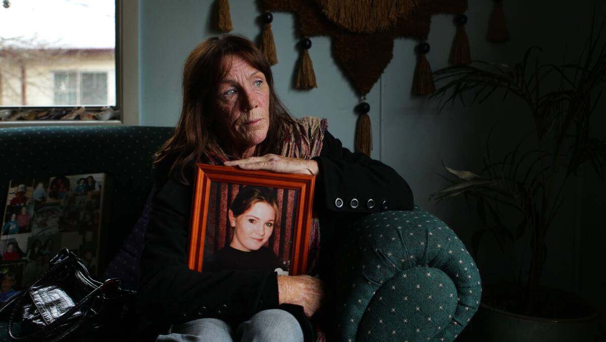 STILL WAITING: Bathurst woman Ricki Small with a portrait of her 15-year-old daughter Jessica, who disappeared in 1997. 