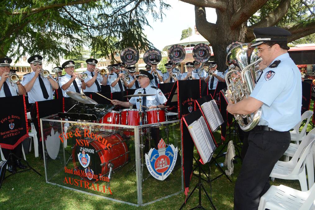 HUGE SUCCESS: The Fire and Rescue NSW Band played on Kings Parade on Saturday as part of the Firefighters State Championships. Photo: PHILL MURRAY 102514pband2