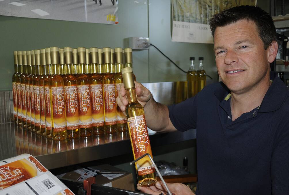 NEW FLAVOUR: Stone Pine Distillery owner Ian Glen shows off his new Honey Liqueur. Photo: CHRIS SEABROOK 102014cstonepin