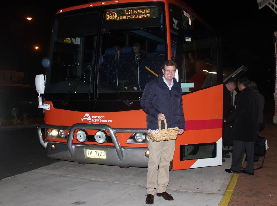 MUFFIN BREAK: Orange MP Andrew Gee handed out muffins to passengers taking advantage of the new Bathurst Bullet bus linking service. 061515gee