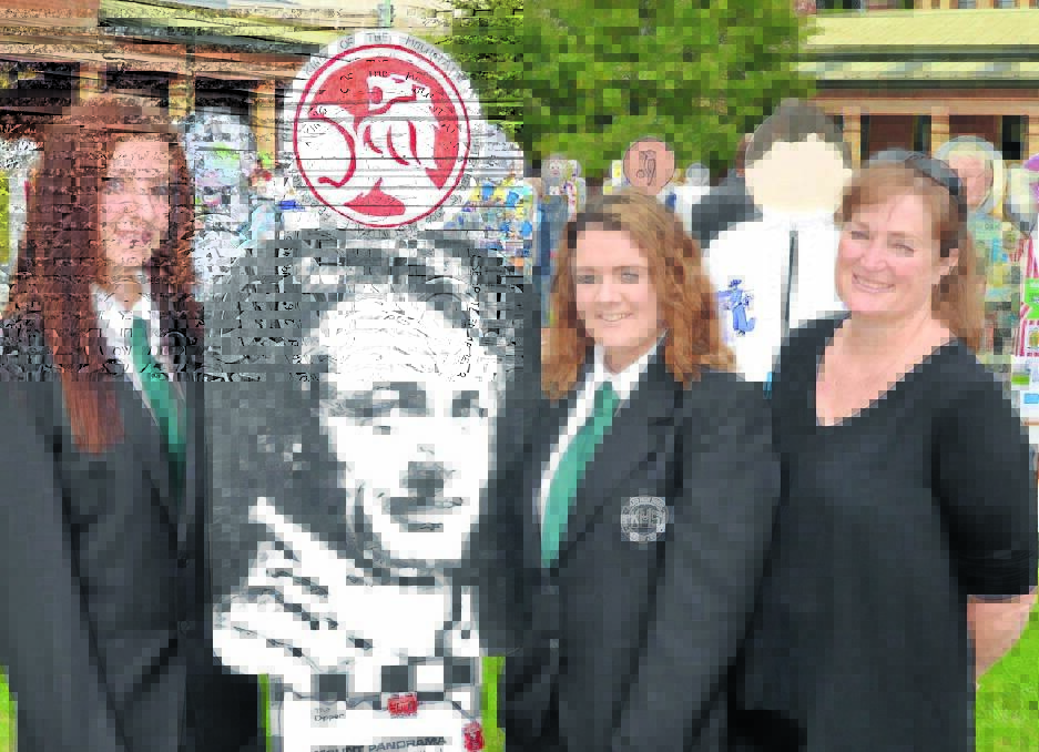 PEOPLESCAPE: Kelso High School’s Zerlina O’Donnell, with “Peter Brock”, Amber McDonald and Selina Ash, at the official opening of the exhibition yesterday. Photo: PHILL MURRAY   