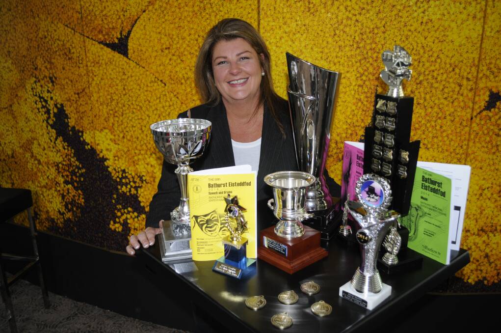 TODAY IS THE DAY: Bathurst Eisteddfod Society president Paula Elbourne with just some of the trophies to be awarded during the Bathurst Eisteddfod, which starts today. Photo: CHRIS SEABROOK 082514ceisted