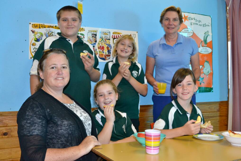 TIME WELL SPENT: Kelso Public School’s Breakfast Club is in need of more volunteers to assist three days a week with preparing and serving students a nutritious breakfast. Pictured, from back, are Isaak White-Rolzhauser, Emily Daniels, volunteer Carol Patterson, co-ordinator Natalie Beattie, Abigail Daniels and Phoebe Brownbridge. Photo: RACHEL FERRETT 030415rfbreakfast