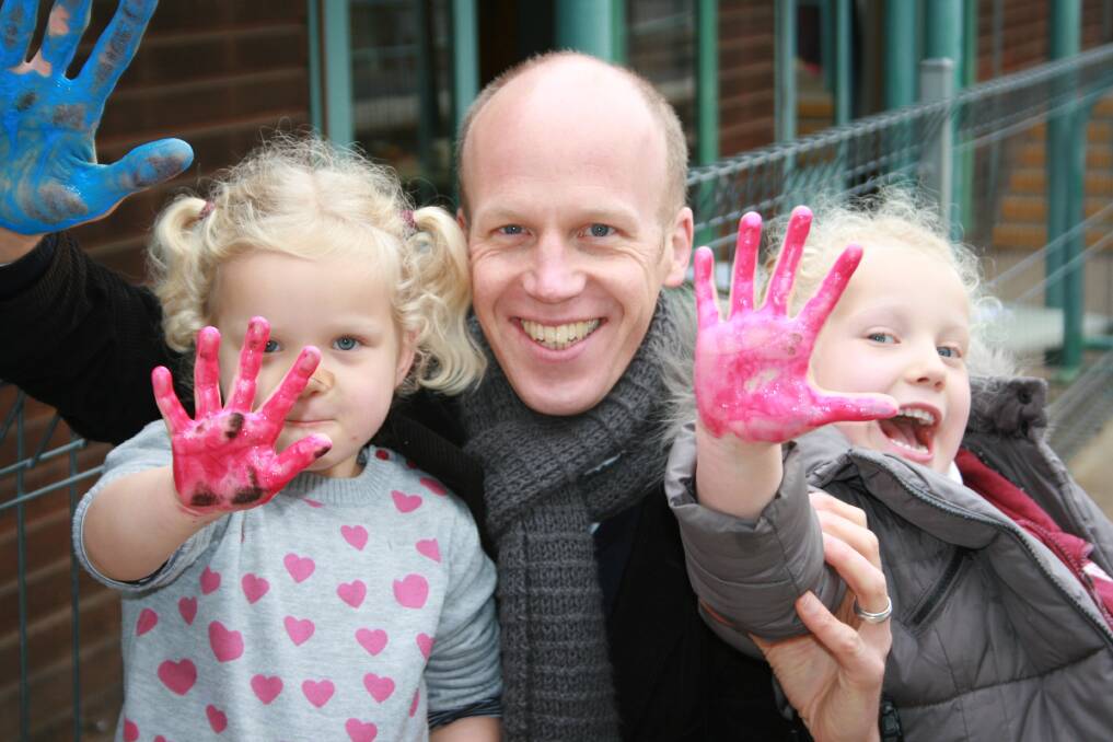 IN THE PINK: Graham Low with daughters Poppy and Alice at yesterday’s Father’s Day breakfast. 090415dad1