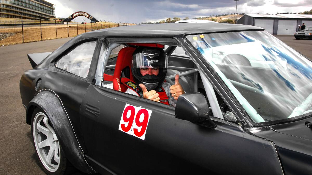 GET SET: Phillip Ryan gives the thumbs up before getting set to take on Saturday’s supersprint in his Nissan 280ZX. 113014zspeed10