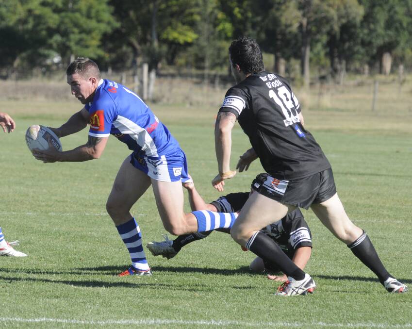 IMPRESSIVE: St Pat’s playmaker Tim Holman tries to break through Forbes’ defensive line in their match on Saturday. Photo: CHRIS SEABROOK 032815cfooty3