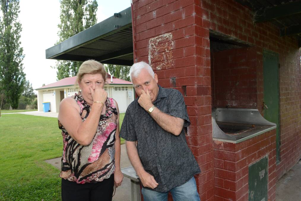 STINKY: Barbara Andrews and Dale Cassidy of the Lions Club of Bathurst think putting a sewage dump close to the picnic tables and barbecues at Berry Park would be a bad idea. Photo: PHILL MURRAY 012214plions