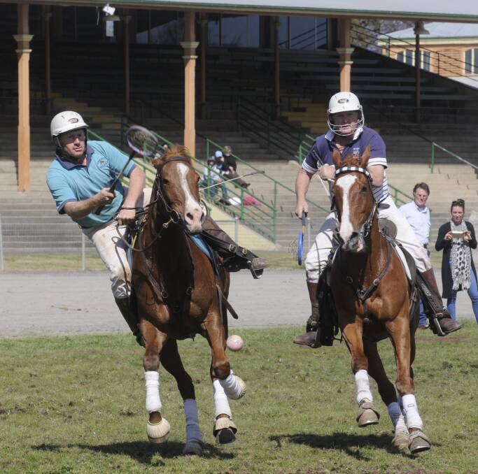 GOAL: Angus Stuart from Mendooran throws the ball to post a goal against the Lake George team in the A grade mixed final of the Polocrosse Carnival, held at the Bathurst Showground yesterday. Photo: CHRIS SEABROOK 083015cpolox1
