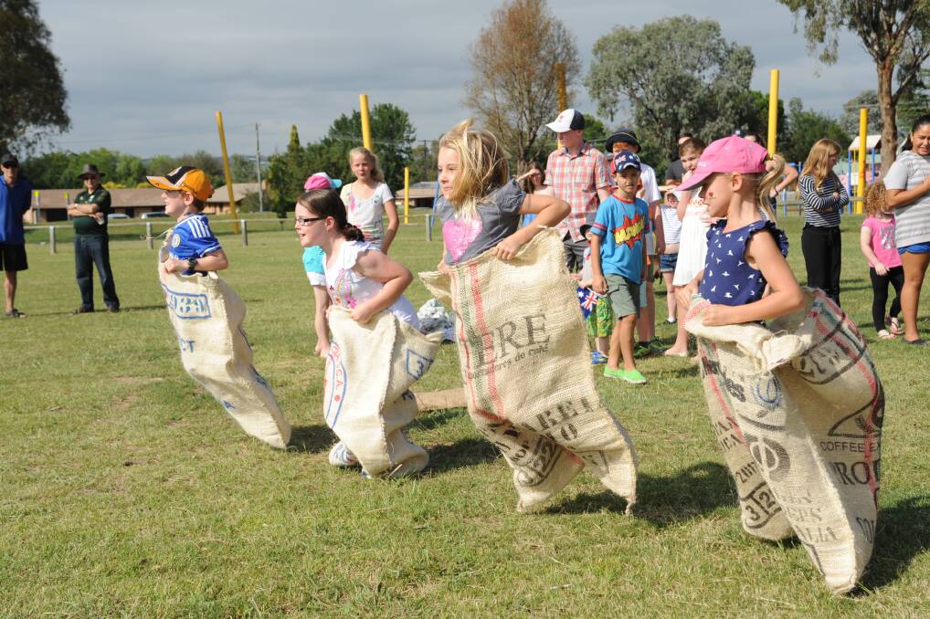 SACK FULL OF FUN: The sack races were one of the highlights of Eglinton’s Australia Day celebrations yesterday. Photo: CLARE LEWIS       012615aus30