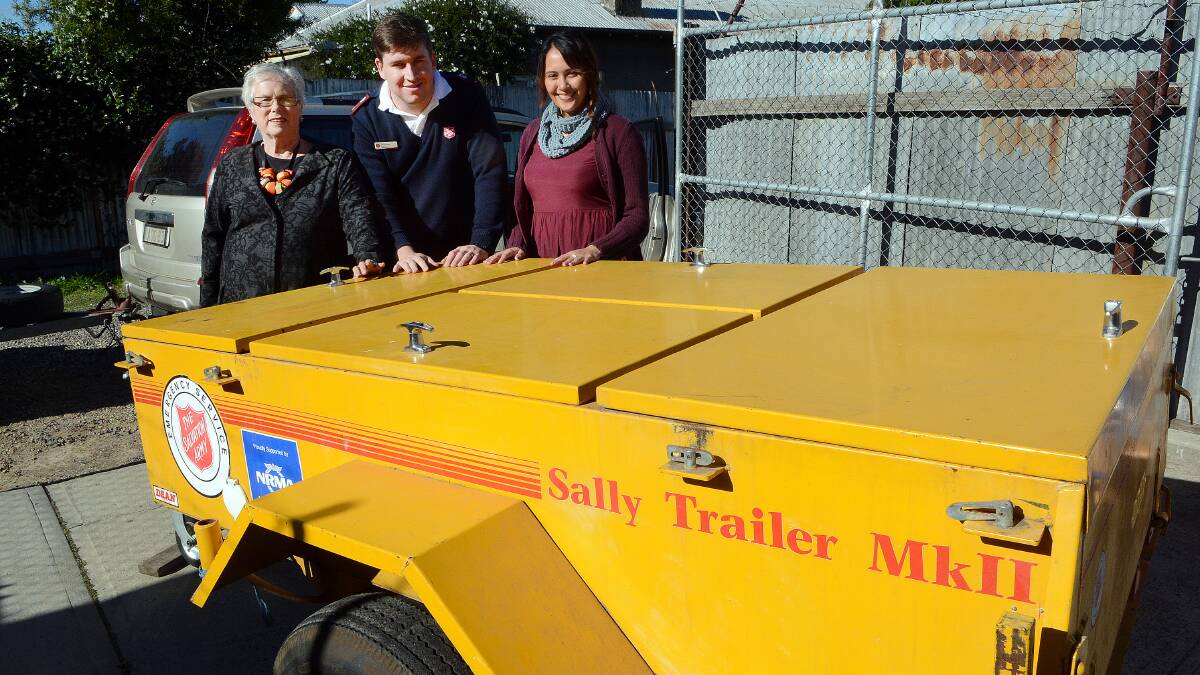 LAST LEGS: Bathurst/Oberon Red Shield Appeal chair Councillor Monica Morse, Lieutenant Aaron Reid and Red Shield Appeal media officer Monika Malcolm with the old emergency trailer which desperately needs replacing. Photo: PHILL MURRAY 050114pred