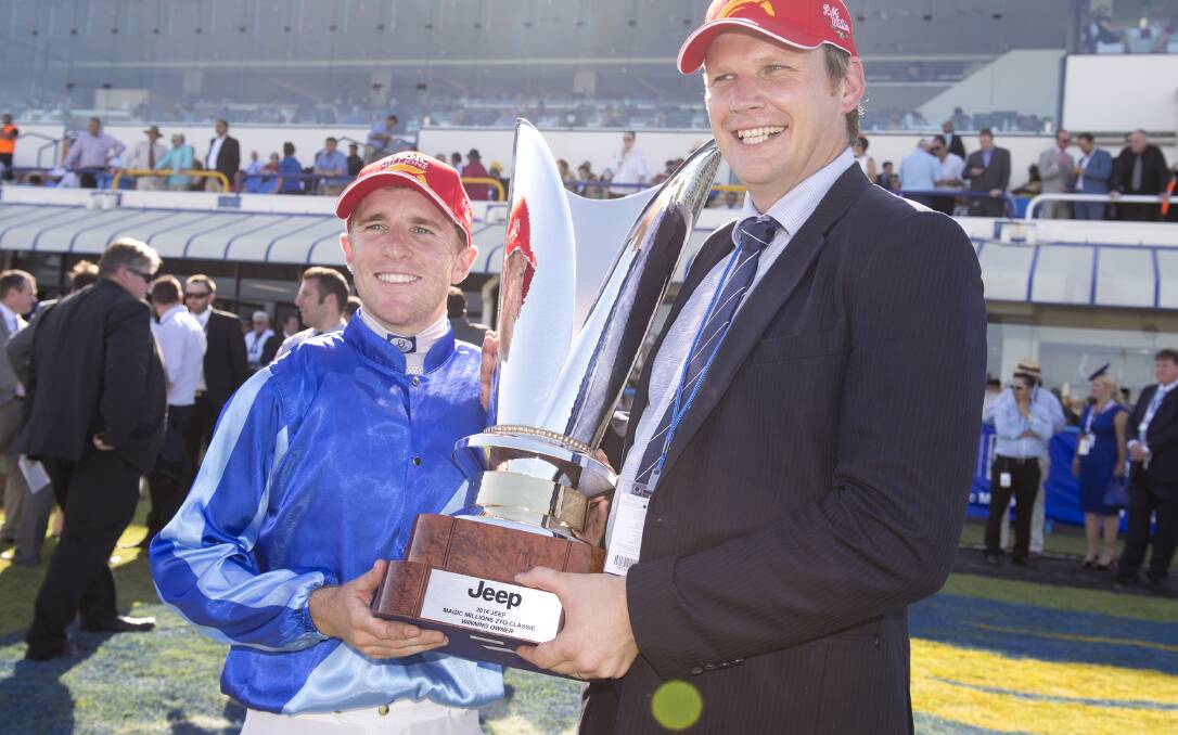 SAD TIMES: Jockey Nathan Berry and former Bathurst resident Bjorn Baker pose after Unencumbered won at the Magic Millions raceday at the Gold Coast turf club in January. Baker, a noted trainer, was one of many who were saddened by Berry’s death late last week. Photo: Harrison Saragossi 040714baker