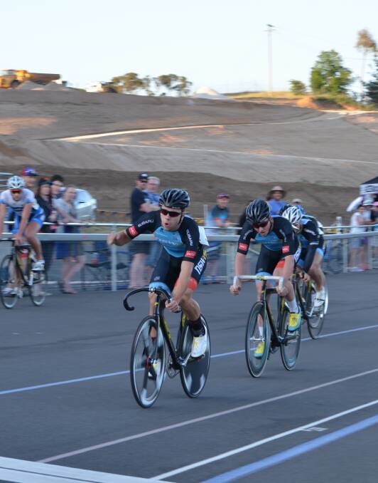 YES!: Nick Yallouris pumps his fist as he takes out the inaugural Bathurst 200 Wheelrace ahead of team-mate Jackson Law. Photo: ANYA WHITELAW 112115yallouris