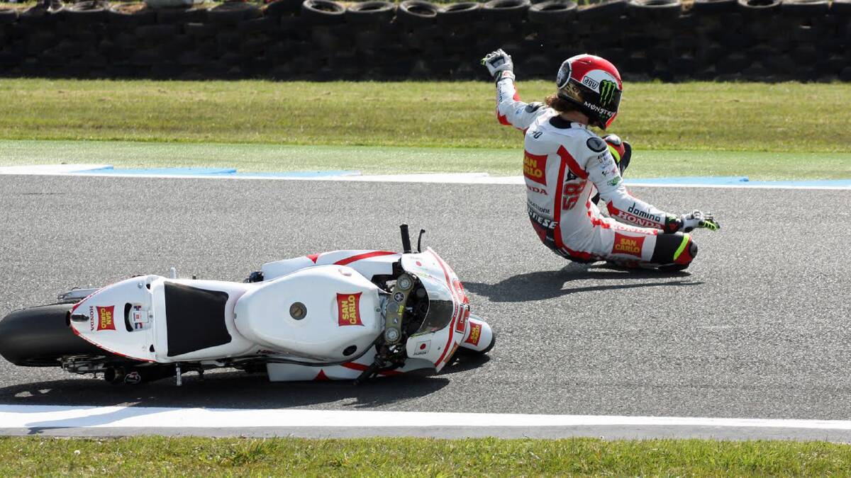 A MOMENT IN TIME: The late Italian MotoGP rider Marco Simoncelli takes a tumble at the Australian Moto GP at Phillip Island. Photo: DARRIN GROSE