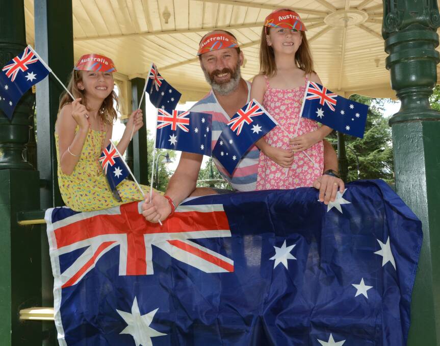 OUR DAY: Matt McRobert with his daughters Ruby, 9, and Claudia, 6, will be among the many Bathurstians expected to flock to Australia Day celebrations today. Photo: PHILL MURRAY 012115pauusie
