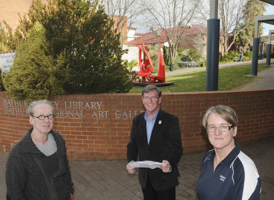 ANOTHER BRICK IN THE WALL: Bathurst Regional Art Gallery director Richard Perram OAM, Bathurst mayor Gary Rush and Bathurst Library’s Beth Hall say proposed works for the forecourt will be a boost for the community. Photo: CHRIS SEABROOK 090114cwall