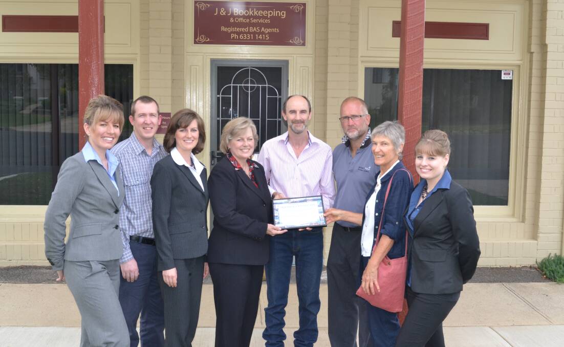 RECOGNISED: Bookkeeper Megan Kauter, owners Paul and Jacqui Koscar and Joanne and Peter Scott, deputy mayor Ian North, Chris Perrers from the local District Branch of the National Trust and bookkeeper Elizabeth Berthet with the heritage award. Photo: Kate Burke  032114award1